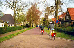 Biking through a village, Holland